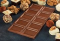 Bar milk chocolate close up on dark stone surface Royalty Free Stock Photo