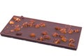 Bar Milk Chocolate with nuts. Background. Close-up Royalty Free Stock Photo