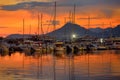 Bar, Montenegro - August 21, 2022: Amazing view of sunset with yachts and lighthouse on the background on the Adriatic coast near Royalty Free Stock Photo