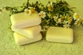 Bar of natural handmade soap and chamomile