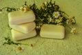 Bar of natural handmade soap and chamomile