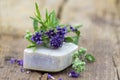 Bar of natural soap and lavender flowers Royalty Free Stock Photo