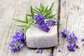 Bar of natural soap, lavender flowers and rosemary Royalty Free Stock Photo