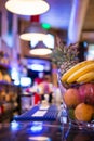 Bar at Night. Blurred Back Bar. Fruit on Bar Counter.