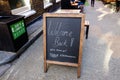 A bar pub chalk board sign. Saying welcome back, we`ve missed you.