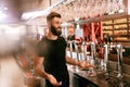 Bar Pub. Male Bartender Standing At Bar Counter