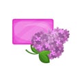 Bar of purple hygienic soap and flowering branch of lilac. Refreshing spring smell. Natural product for skin care