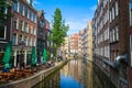 Bar and row houses by the canal in Amsterdam, Netherlands Royalty Free Stock Photo