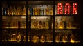 BAR sign with lights in the dark with many shapes of bottles of alcohol Royalty Free Stock Photo