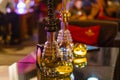 Bar for smoking a hookah. The background is blurred. In the foreground is a big hookah Royalty Free Stock Photo