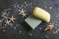 Bar of soap, starshells, sea salt on the dark grey surface Royalty Free Stock Photo