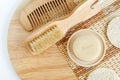 Bar of soap, wooden hair brush, body massage brush and loofah sponge. Natural beauty treatment, skip-care, zero waste concept. Royalty Free Stock Photo