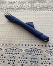 Bar Table Serving Knife and Fork Nicely Wraped in Blue Paper Napkin Royalty Free Stock Photo