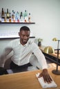 Bar tender cleaning bar counter in restaurant Royalty Free Stock Photo