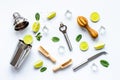 Bar utensils and tools for Mojito cocktail - shaker, lime and ice Royalty Free Stock Photo