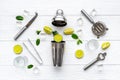 Bar utensils and tools for Mojito cocktail - shaker, lime and ice Royalty Free Stock Photo