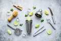 Bar utensils and tools for Mojito cocktail - shaker, lime and ice Royalty Free Stock Photo