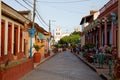 Street with colorful houses in colonial town Baracoa, Cuba