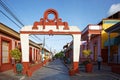 Street with colorful houses in colonial town Baracoa, Cuba