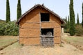 Reconstruction of an Etruscan hut in the Archaeological Park of Baratti and Populonia. Tuscany - Italy