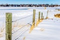 A barb wire fence in a snow covered field Royalty Free Stock Photo