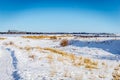 A barb wire fence in a snow covered field Royalty Free Stock Photo