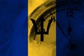 Barbados, Barbadian flag with clock close to midnight in the background. Happy New Year concept