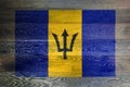 Barbados flag on rustic old wood surface background Royalty Free Stock Photo