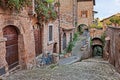 Barbarano Romano, Viterbo, Lazio, Italy: picturesque corner, narrow alley, ancient houses in the old town of the medieval village Royalty Free Stock Photo