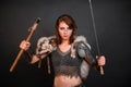 Barbarian woman warrior in chainmail armor with bracers, armor shoulder pad, polar fox fur on her shoulders Royalty Free Stock Photo