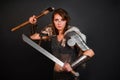 Barbarian woman warrior in chainmail armor with bracers, armor shoulder pad, polar fox fur on her shoulders Royalty Free Stock Photo