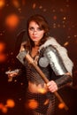 Barbarian woman warrior in chainmail armor with bracers, armor shoulder pad, polar fox fur on her shoulders Royalty Free Stock Photo