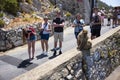 Tourist watch barbary macaques in Gibraltar