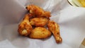 barbecue chicken wings or buffalo wings close up on wooden tray shot with selective focus Royalty Free Stock Photo