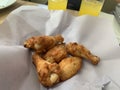 barbecue chicken wings or buffalo wings close up on wooden tray shot with selective focus Royalty Free Stock Photo