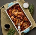 Barbecue chicken wings. Slow cooker sweet and spicy. Oven baked marinated chiken in blue ceramic tray Royalty Free Stock Photo