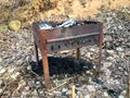 Barbecue for cooking meat on fire, barbecue and outdoor recreation old, rusty, iron, metal