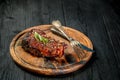 Barbecue Dry aged Ribeye Steak with knife and fork on cutting board Royalty Free Stock Photo