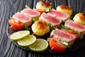 Barbecue of fresh tuna, tomatoes, potatoes and green onion on sk Royalty Free Stock Photo