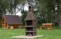 barbecue garden, grass benches and a brick grill