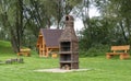 barbecue garden, grass benches and a brick grill