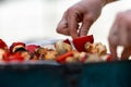 Barbecue in the garden, you can see skewers, chicken and mushrooms and peppers. Metal sheet over heated coals. Royalty Free Stock Photo