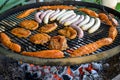 Barbecue grill bbq on coal charcoal grill with steaks bratwurst sausages and meat delicious summer meal Royalty Free Stock Photo