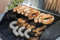 Barbecue grill bbq on propane gas grill steaks bratwurst sausages meat meal Royalty Free Stock Photo