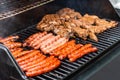 Barbecue grill bbq on propane gas grill steaks bratwurst sausages meat meal Royalty Free Stock Photo