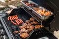 Barbecue grill bbq on propane gas grill steaks bratwurst sausages meat meal Royalty Free Stock Photo