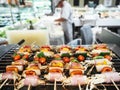 Barbecue grill with Blurred kitchen and chef