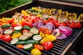 barbecue grill filled with colorful grilled veggies