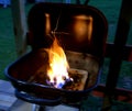 Barbecue Grill With Flaming Charcoal Briquettes Royalty Free Stock Photo