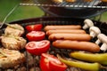 Barbecue grill with meat, sausages and vegetables, closeup Royalty Free Stock Photo